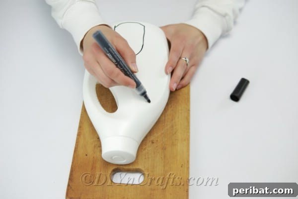 Drawing windows and doors on a jug with a marker, illustrating creative design possibilities