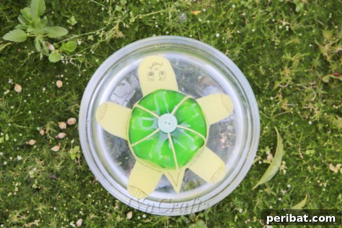 A vibrant green and yellow plastic bottle turtle craft floating gracefully in clear water, showcasing its upcycled design and readiness for play.