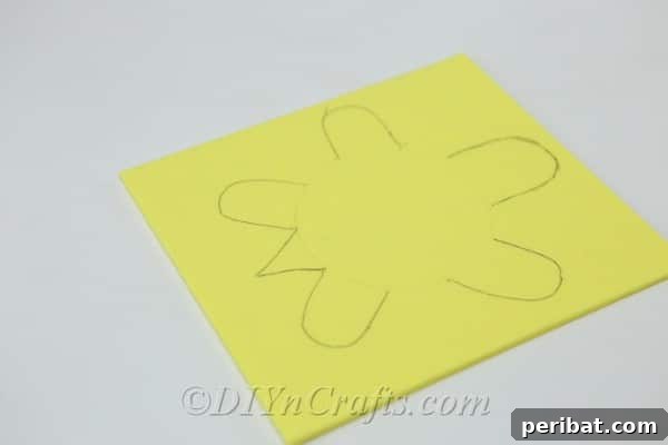 The full turtle shape, including head, legs, and tail, neatly drawn onto yellow craft foam.
