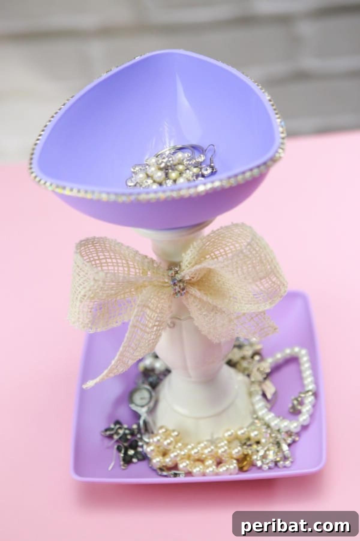 Upcycle Plates into a Stylish Two-Tier Jewelry Holder 2 Top view of jewelry holder with assorted jewelry inside