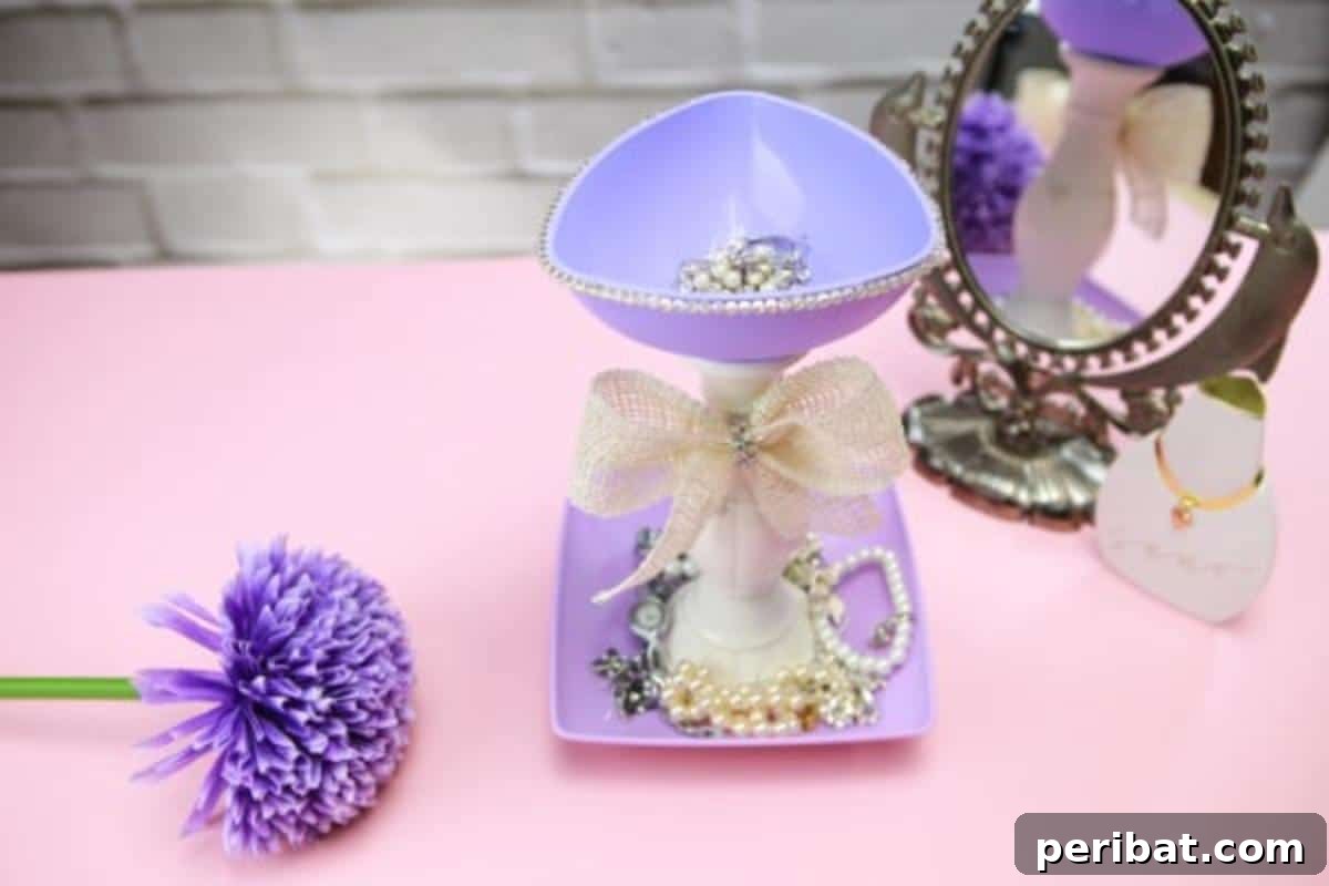 Upcycle Plates into a Stylish Two-Tier Jewelry Holder 10 Top view of jewelry holder with a mirror and purple scrunchies beside it