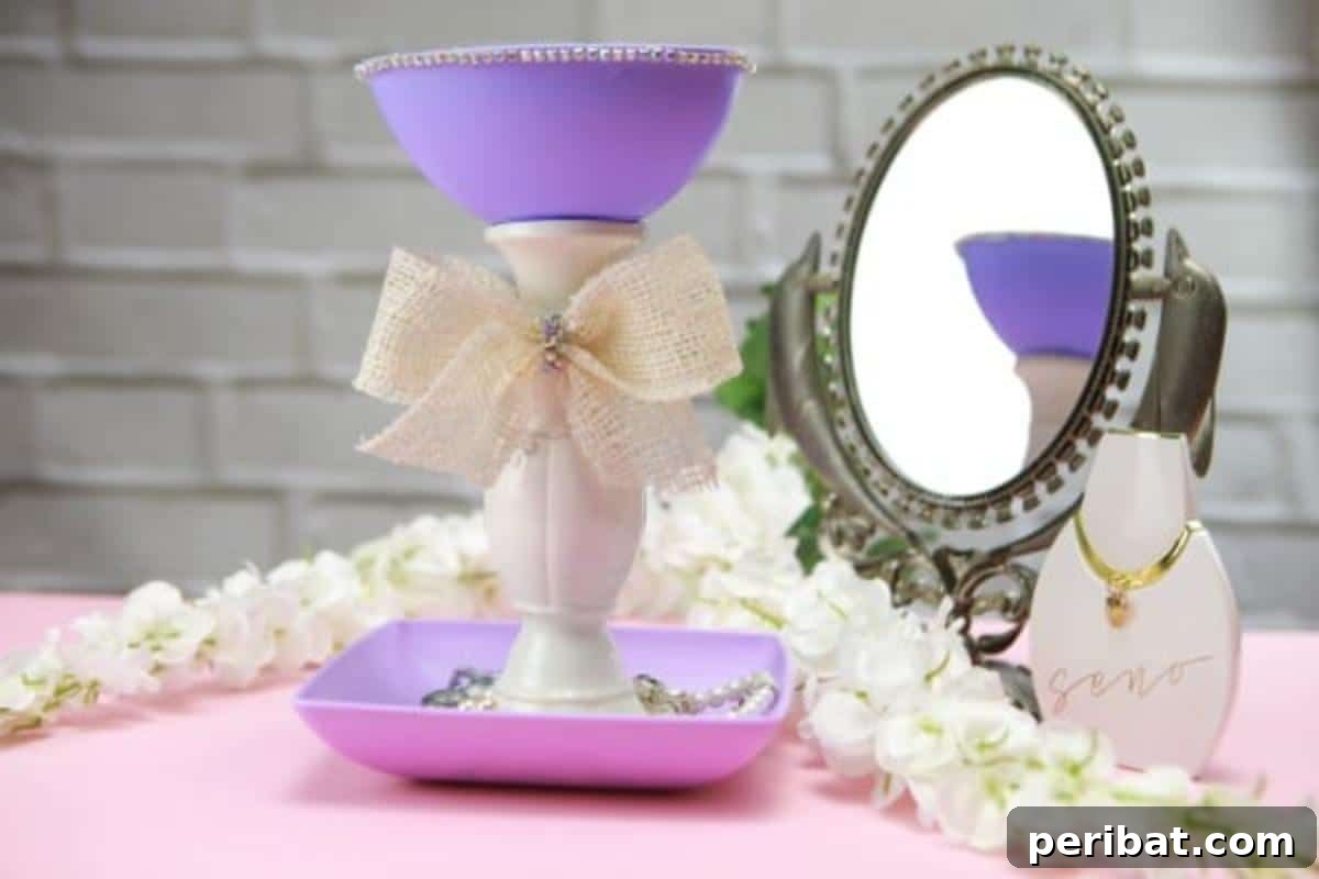 Upcycle Plates into a Stylish Two-Tier Jewelry Holder 4 Jewelry holder sitting beside a mirror on a dresser