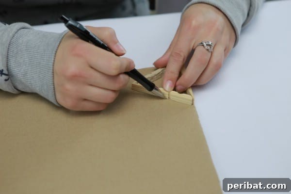Tracing the clothespin lamp base onto cardboard for a bottom