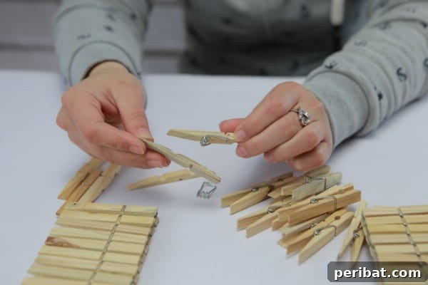 Transform Clothespins into a Stylish Lamp 9 Clothespin halves after removing springs