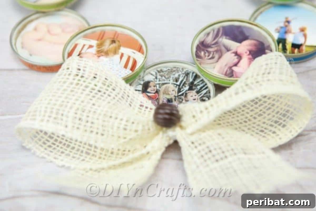 Close-up of a rustic burlap bow attached to a DIY photo wreath, highlighting the textured detail of the decoration.
