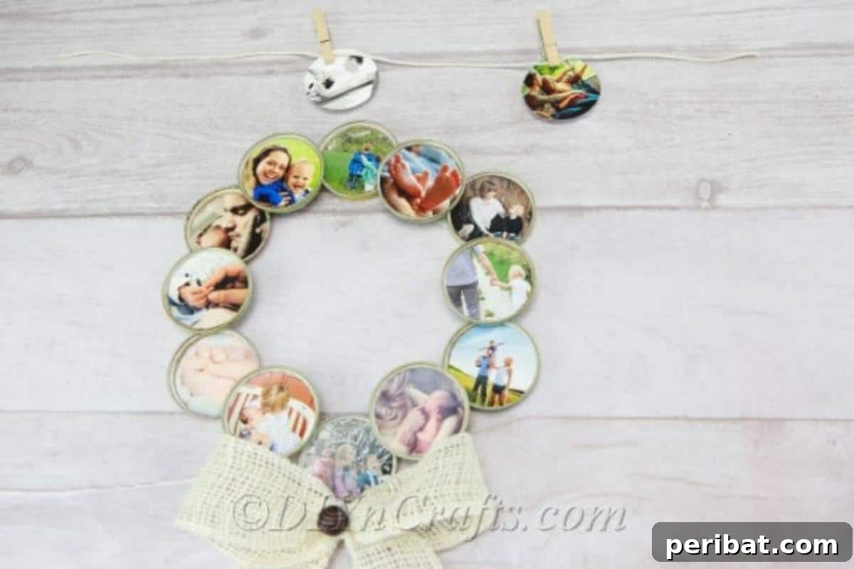 A finished photo wreath made from repurposed jar lids, featuring a prominent rustic bow and a collection of family pictures.