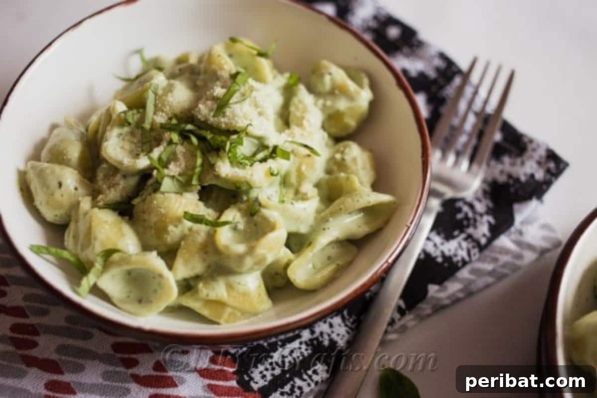 Ingredients for creamy blue cheese pasta with yogurt and fresh basil leaves