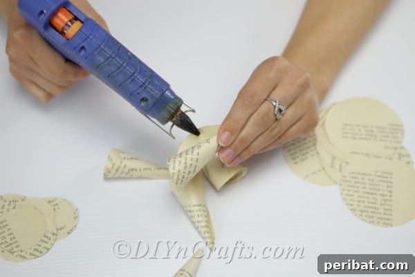 Literary Blooms: Crafting Flowers from Old Book Pages 10 Apply glue to hold the cones in their new shapes.