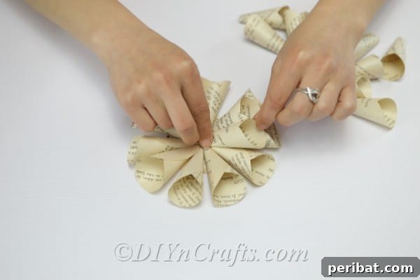Literary Blooms: Crafting Flowers from Old Book Pages 16 Continue making your second layer of petals.