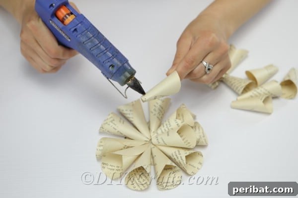 Literary Blooms: Crafting Flowers from Old Book Pages 17 Finish making your second layer of petals.