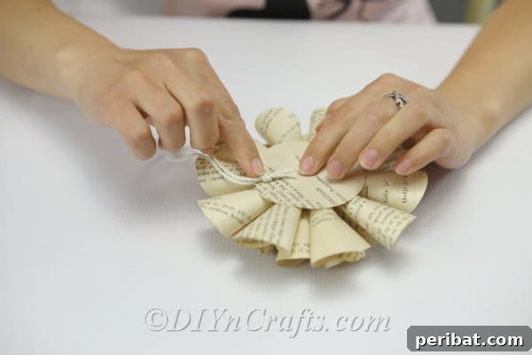 Literary Blooms: Crafting Flowers from Old Book Pages 20 Attach some twine to the back of the flower.