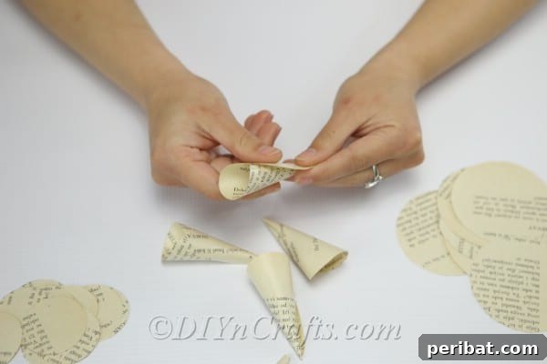Literary Blooms: Crafting Flowers from Old Book Pages 9 Shape the circles into cones.