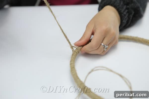 Crafting Your Own Rustic Wind Chime 11 Continue tying pieces of twine to your hoop.