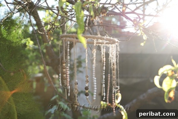 Crafting Your Own Rustic Wind Chime 18 Your DIY rustic wind chime looks lovely in the sunlight.