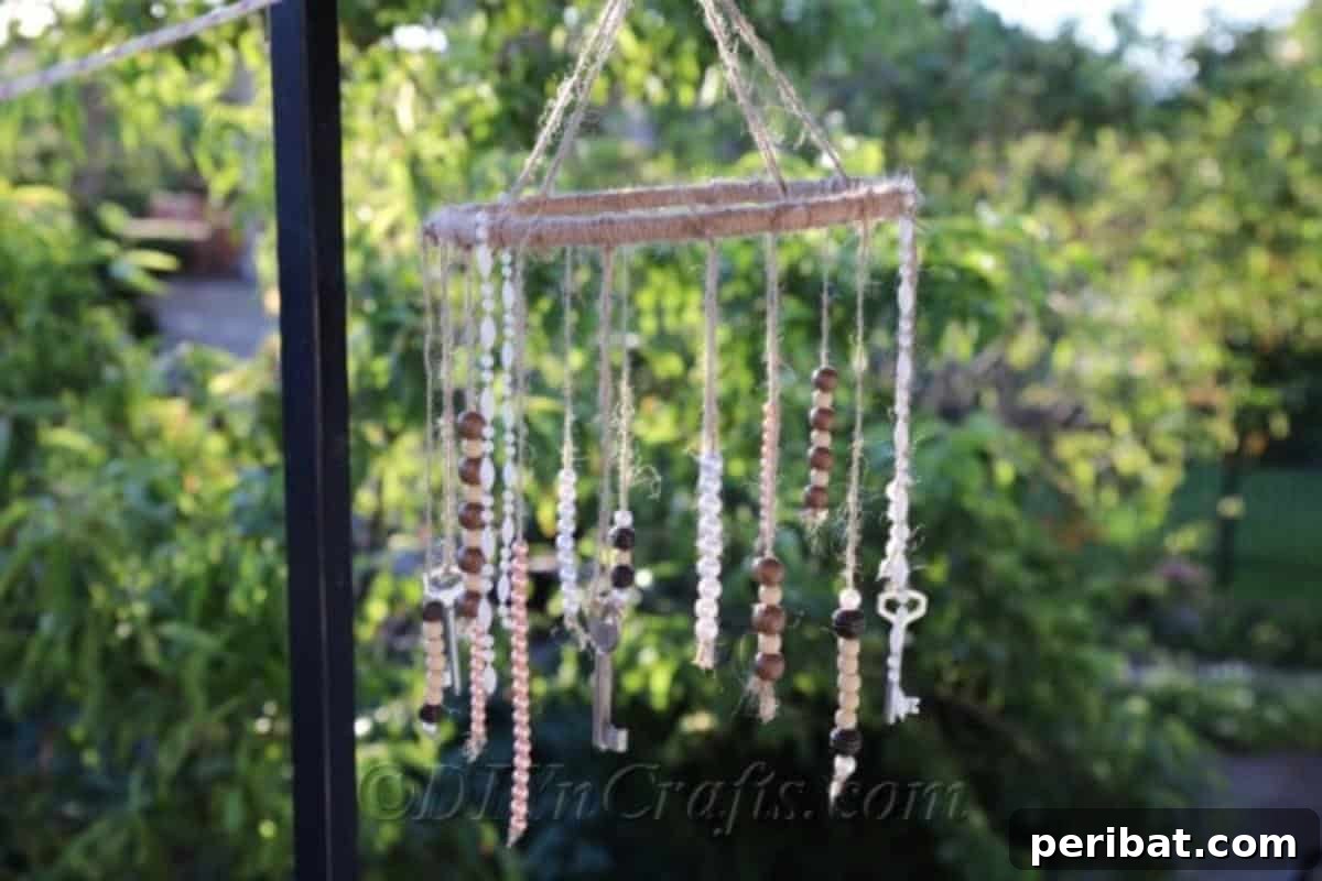 Crafting Your Own Rustic Wind Chime 3 It is easy to make rustic wind chimes. A close-up of a partially assembled wind chime, showcasing the twine-wrapped wooden hoop and hanging keys.