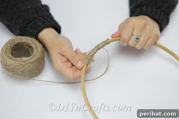 Crafting Your Own Rustic Wind Chime 6 Wind twine around the wooden hoop.