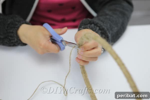 Crafting Your Own Rustic Wind Chime 8 Use a pair of scissors to cut the end of the twine.