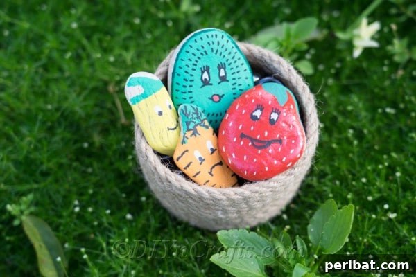 Charming Hand-Painted Stone Garden Labels 14 It’s time to enjoy your finished DIY painted garden markers, showcasing a beautiful arrangement.