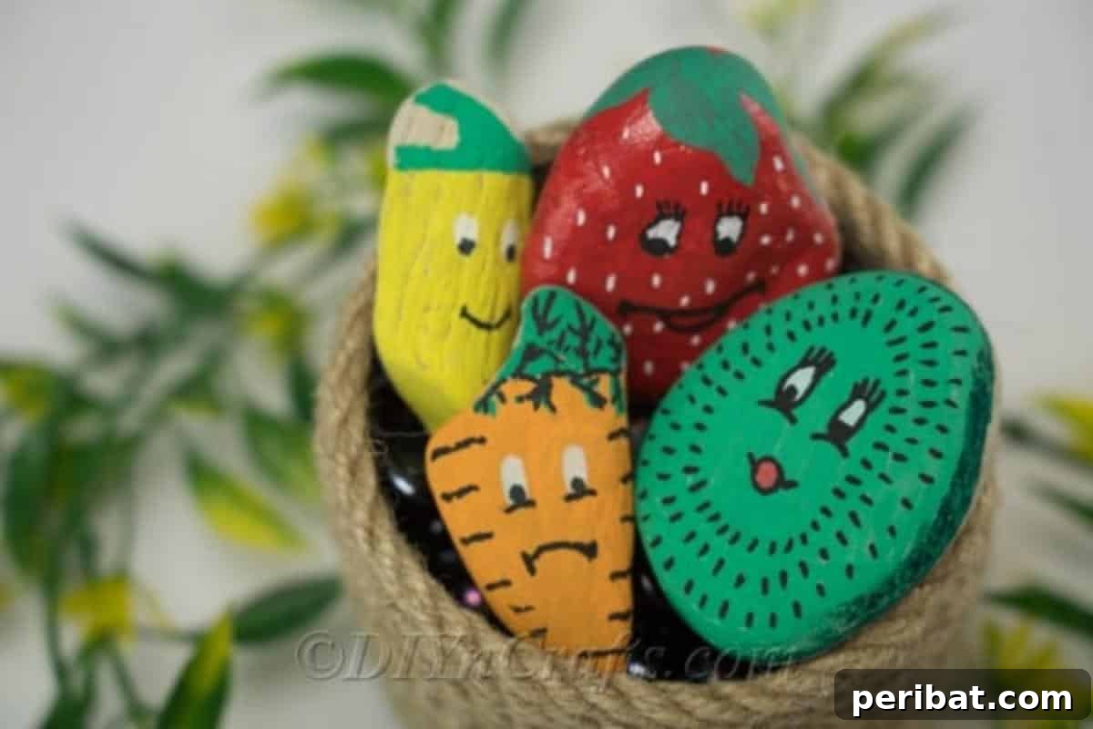Charming Hand-Painted Stone Garden Labels 4 These adorable painted garden markers, shaped like various fruits, look great on display in a garden bed.