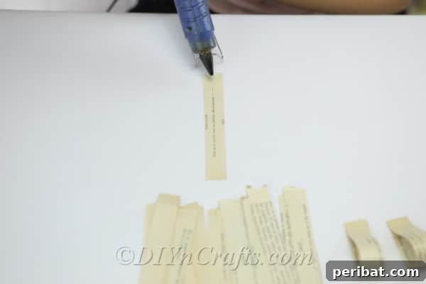 Bookish Blooms Rustic DIY Decor 10 Join the ends of each paper strip to each other with hot glue.