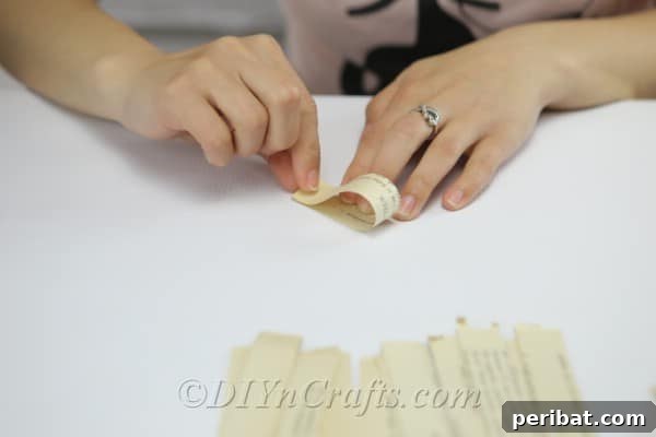 Bookish Blooms Rustic DIY Decor 12 Make many curved petal shapes out of the paper strips.