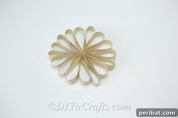 You’ve made a beautiful flower shape from book page petals, ready for its center.