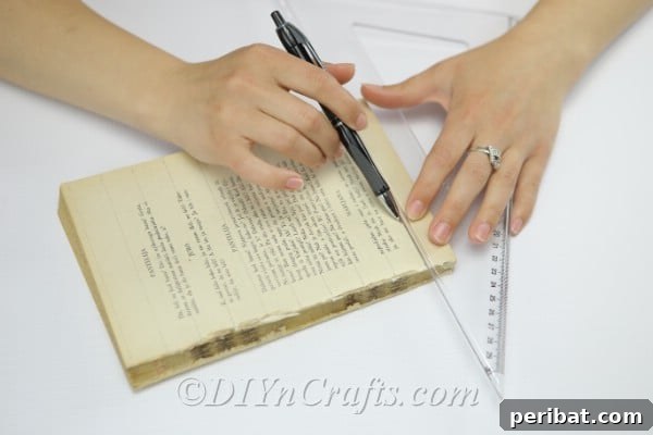 Trace multiple lines across the book page, preparing for cutting.