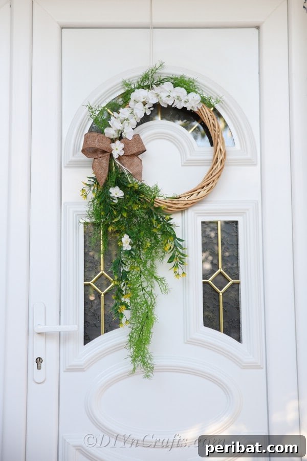 The wreath looks beautiful hanging on the door.