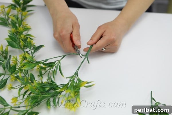 With the pliers, cut the branches you want to use in your wreath.