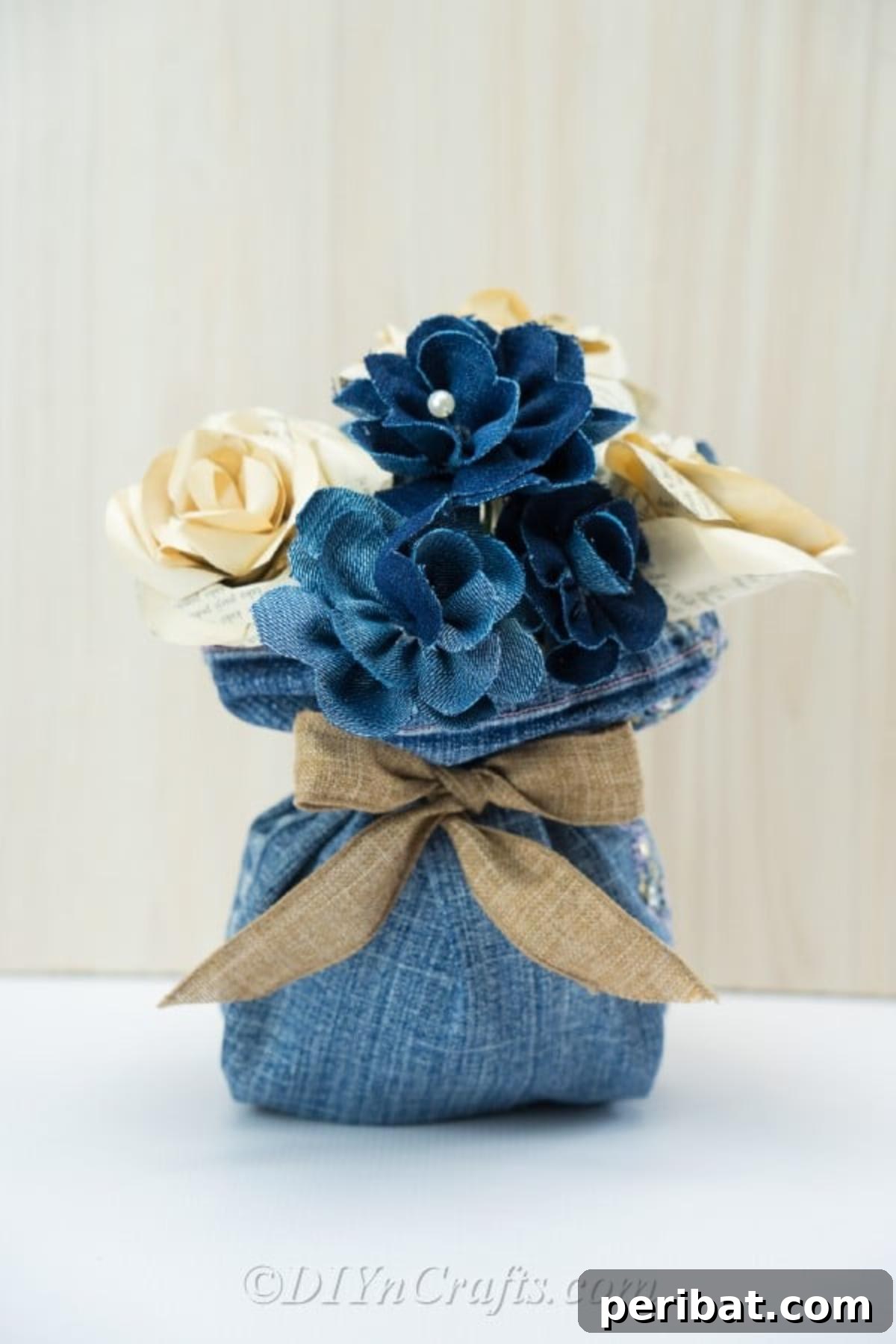 Blooming Denim Art 2 A beautifully arranged floral centerpiece made from upcycled denim, showcasing its rustic charm.