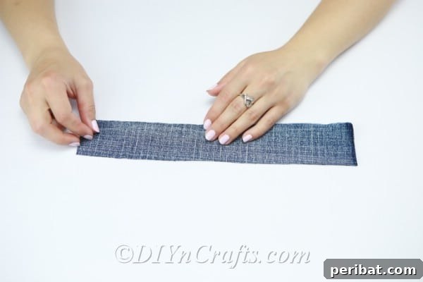 Prepare long strips of denim, approximately 20cm by 3cm, for making flowers.