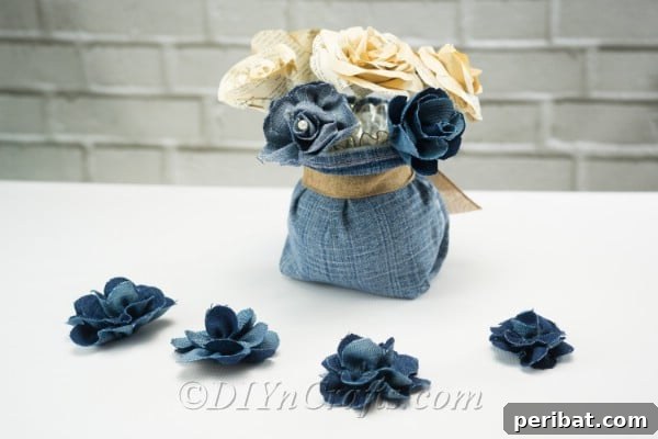 Blooming Denim Art 24 Place the finished denim flowers into the vase to create a rustic centerpiece.