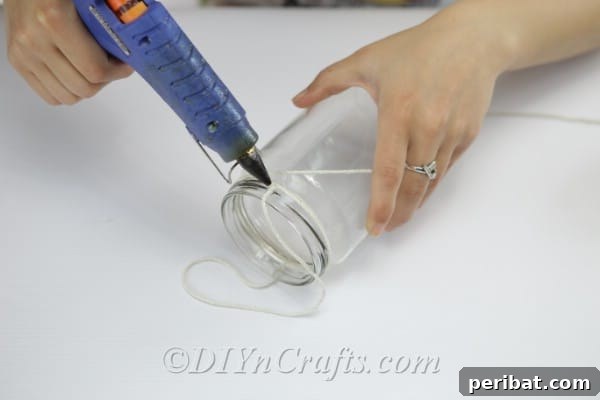 Securely glue the twine loop and wrap around the jar's mouth.