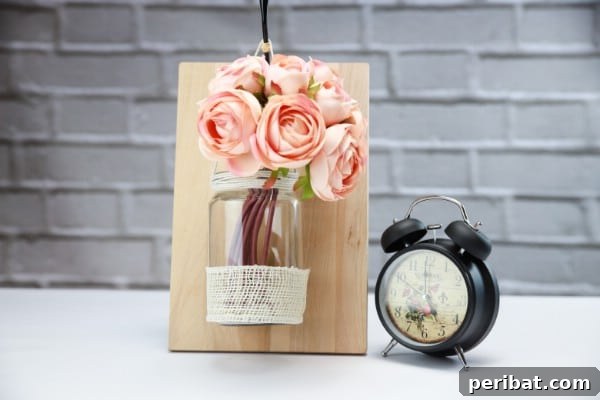 Beautiful DIY Floral Wall Vase made from an old jar.