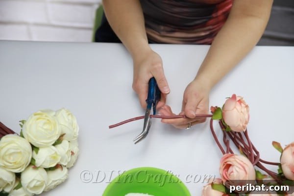 Floral Magic in a Teacup 12 Use diagonal pliers to cut faux flower stems to the desired length for the teacup.