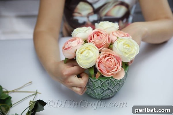 Floral Magic in a Teacup 14 Continue to add and artfully arrange flowers, building fullness and varying heights.