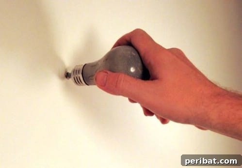 15 Ingenious Upcycled Wall Hooks 7 Concrete Light Bulb Wall Hooks - 15 Unusual and Creative Repurposed Wall Hooks