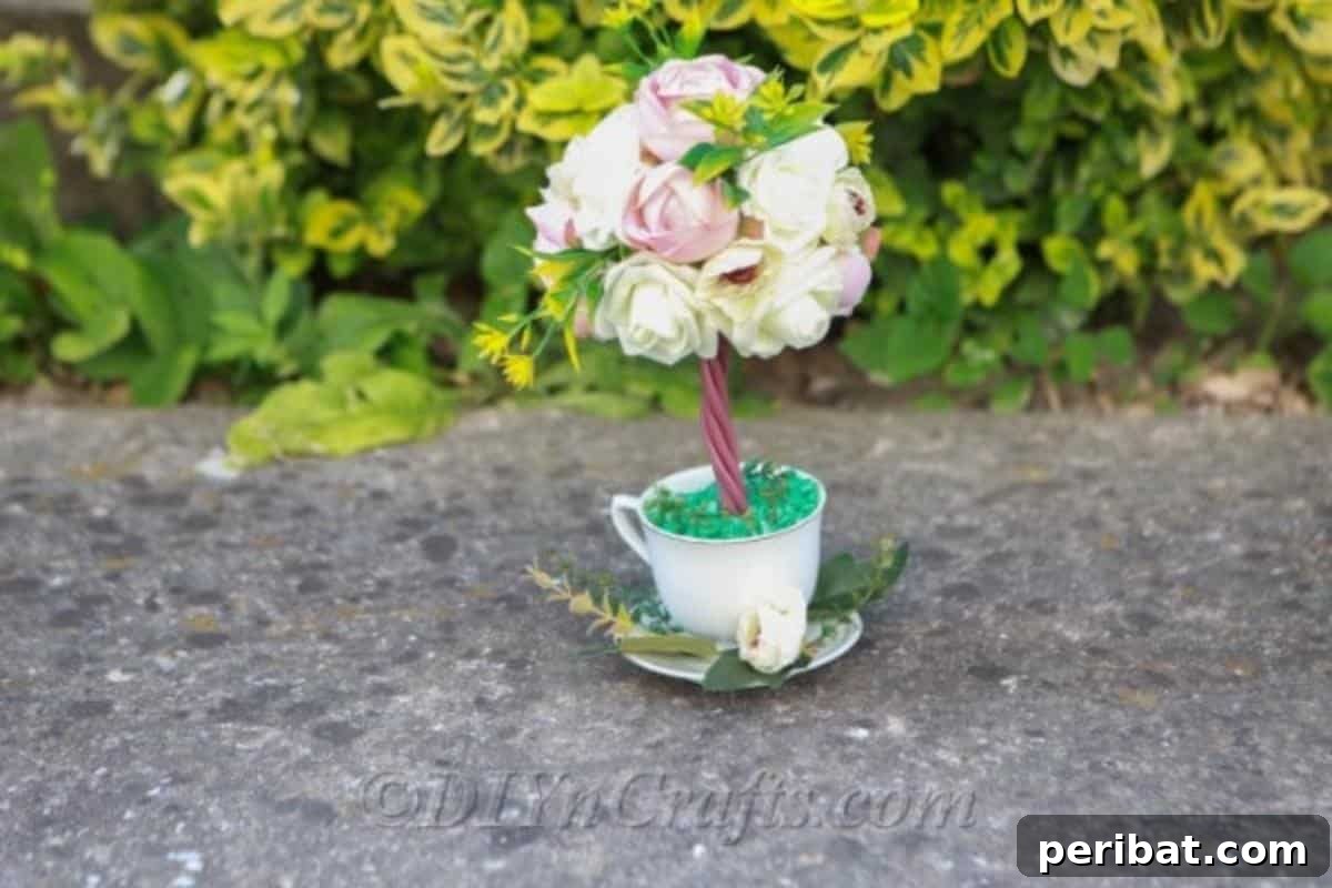 You only need a few essential supplies to craft this beautiful topiary tree flower arrangement.