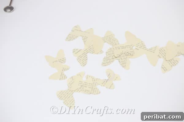 You now have an assortment of large and small butterfly shapes cut from multiple pages, ready for assembly.