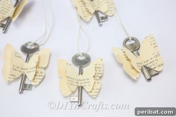 DIY Rustic Butterfly Art from Upcycled Books 19 Butterflies made from old book pages and keys are completed and ready to display as charming decor.