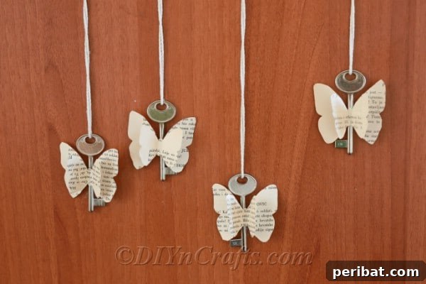 Rustic butterfly decorations crafted from old book pages and vintage keys are beautifully displayed against a warm wood backdrop.