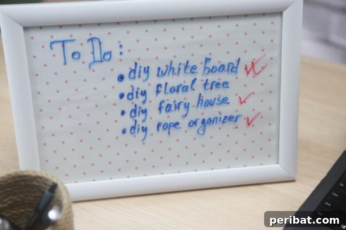 Build a Custom Whiteboard for Your Office 5 Various tasks and notes are neatly listed on a beautifully customized DIY whiteboard, showcasing its practical application in daily organization.