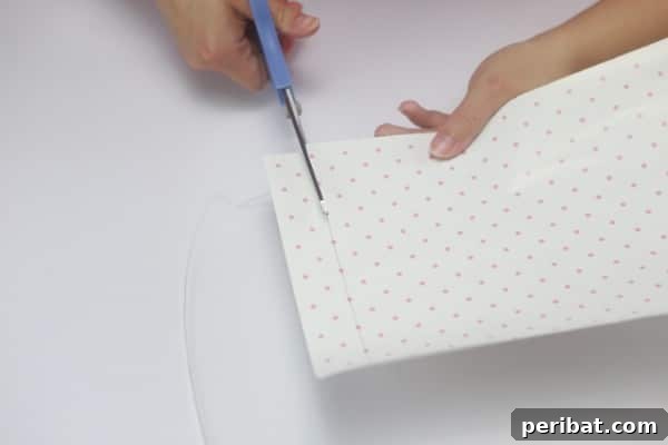 Cut your decorative paper to fit precisely within the picture frame opening.