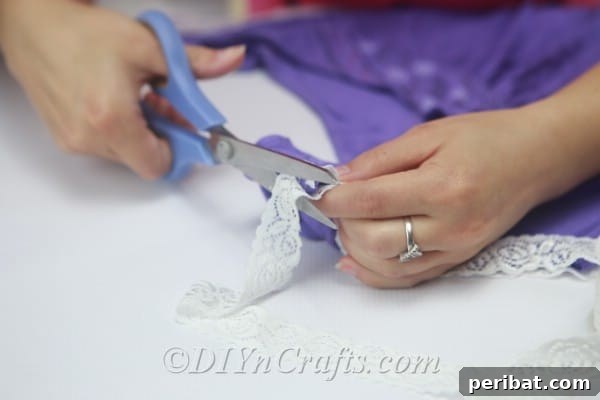 Cut pieces of lace to use for embellishing the sides of your T-shirt bag.