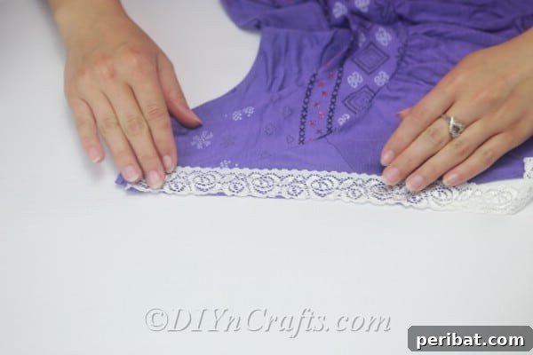 Make sure the lace is firmly adhered to the T-shirt, creating a polished look.