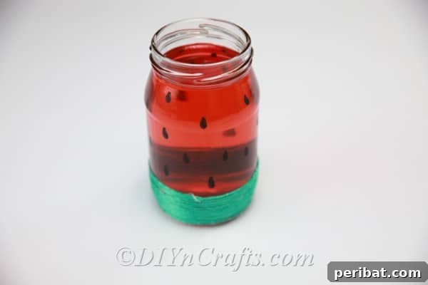 Optionally, paint your watermelon jar with transparent red or pink glass paint for a lasting, vibrant color.