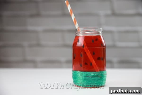 Vibrant Painted Jars for Summer Drinks 15 Complete your fruit jar by inserting a colorful drink straw, making it ready for a refreshing beverage.