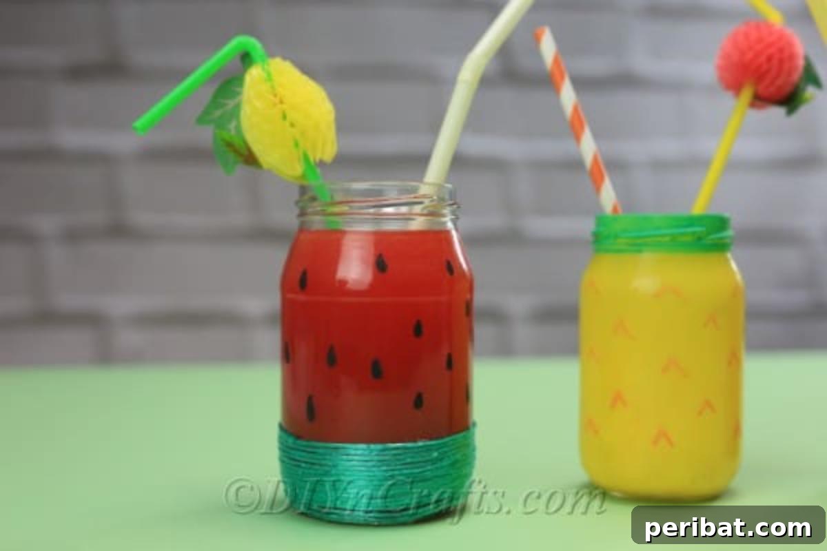 Vibrant Painted Jars for Summer Drinks 4 Assorted fruit-themed drink jars for summer, complete with straws, arranged aesthetically on a rustic green table.