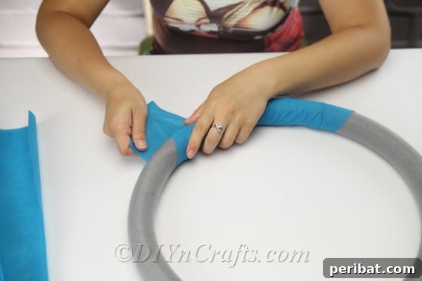 Coastal Elegance: Craft Your Perfect Summer Wreath 11 Wrap the fabric or paper snugly around the hoop, ensuring full coverage of the foam base.