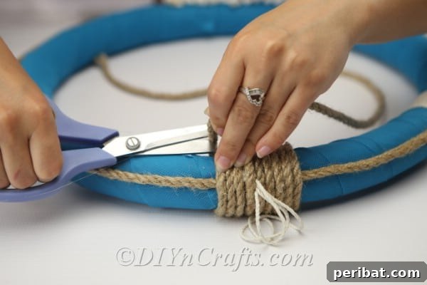 Coastal Elegance: Craft Your Perfect Summer Wreath 23 Finish wrapping the rope around the top, trim any excess, and secure with glue.